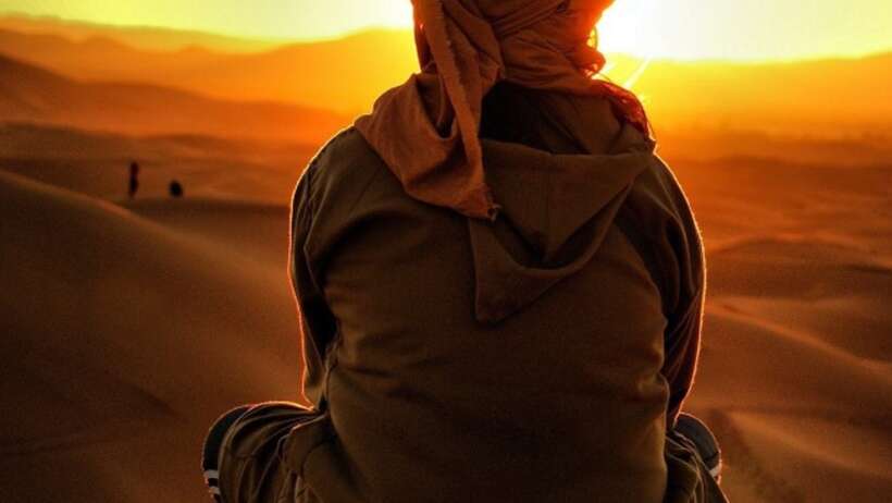 Meditating in the desert at sunset.