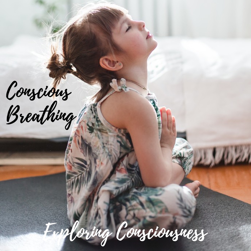 Girl meditating, eyes closed, hands in prayer position.