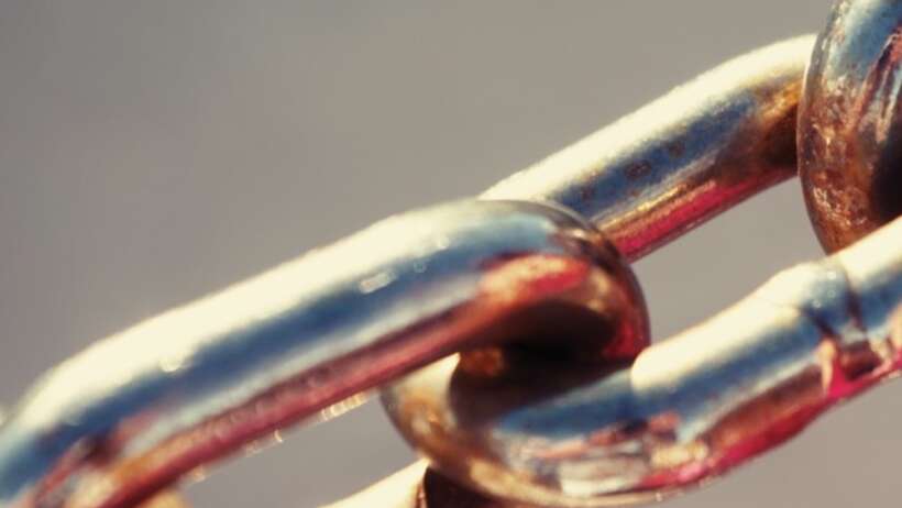 Metal chain links representing 'Chains of Habit'.