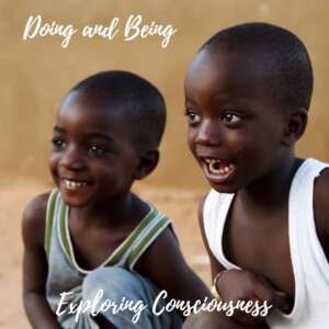 Two young African boys smiling.