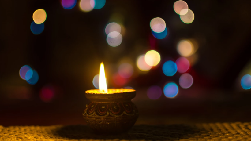 Diwali diya lamp with bokeh lights